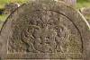 Crest upon tombstone of "Here lies a God-fearing man, the young scholar our teacher the Rabbi R. Israel son of the God-fearing scholar our teacher the Rabbi R. Mosze Plonski Poski. He died Sunday 2nd Cheshvan year 5670 as the abbreviated era.  May her soul be bound in the bond of everlasting life." (szpekh@cwu.edu)